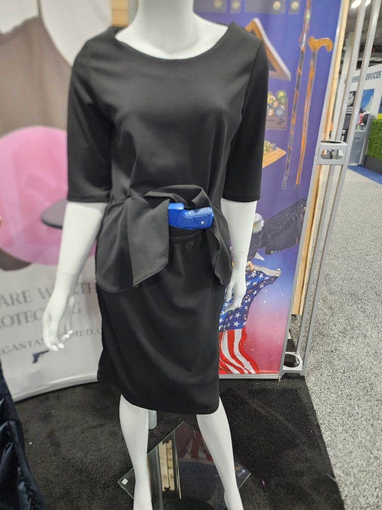 a blue gun in a black dress